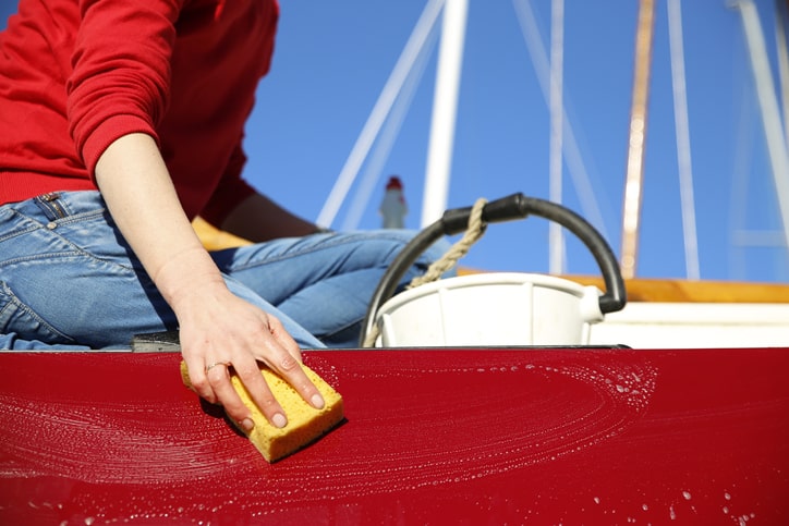 Person Cleaning Boat